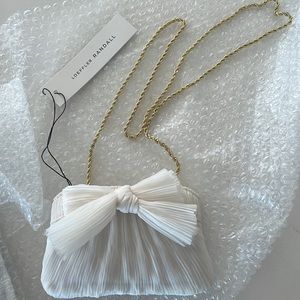 Loeffler Randall 
Mini Pleated Frame Clutch with Bow - Pearl